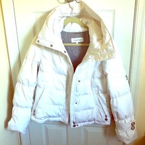 Never worn. Calvin Klein puffer jacket with fleece lining and a big hood